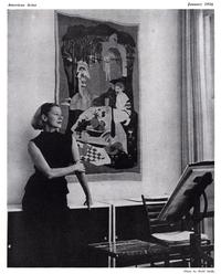 This photo of Evaline Ness at home in her apartment, in front a tapestry she made herself, is from American Artist magazine, January 1956.